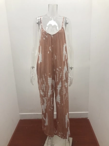Detail of brown and white tie-dye fabric jumpsuit with thin spaghetti straps