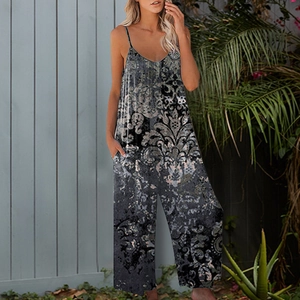 Detail of grey vintage baroque print jumpsuit with V-neckline and functional side pockets