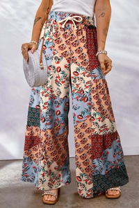 Detail of high waist floral patchwork wide leg pants with adjustable drawstring waist
