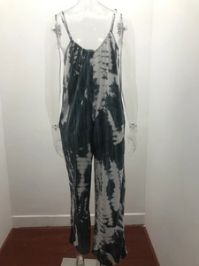 Detail of blue and white tie-dye wide-leg jumpsuit with thin straps and pleated neckline