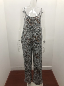 Detail of leopard print jumpsuit featuring spaghetti straps and a V-neckline design