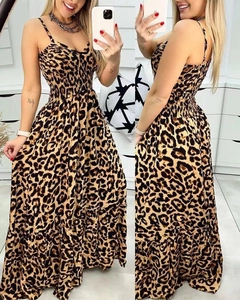 Detail of leopard print dress showing smocked high waist and lightweight fabric texture