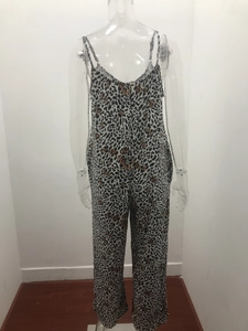 Detail of V-neck leopard print jumpsuit with adjustable spaghetti straps and wide legs