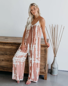 Detail of red and white tie-dye print on a breezy V-neck jumpsuit with thin straps