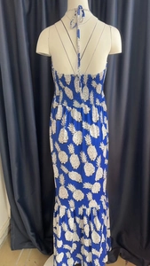 Detail of smocked elastic back and blue pineapple print on halter maxi dress