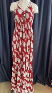 Detail of red halter maxi dress with white pineapple print and smocked waist design