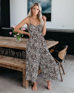 Detail of leopard print jumpsuit featuring spaghetti straps and flowing wide-leg silhouette