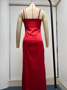 Detailed back view of a red satin maxi dress featuring thin straps and sleek finish