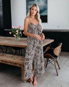 Detail of a chic leopard print jumpsuit featuring thin straps and a wide-leg silhouette