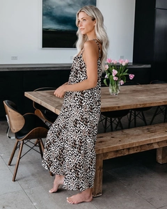Detail view of the leopard print pattern on a flowy spaghetti strap maxi jumpsuit