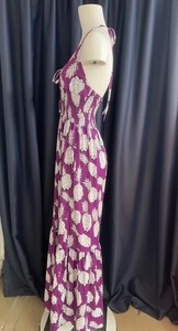 Detail of smocked waist and pineapple print on a purple halter maxi dress for women
