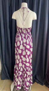 Detail of smocked elastic back and white pineapple print on purple halter maxi dress