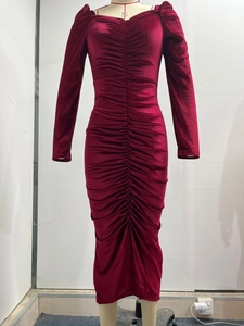 Detail view of the elegant wine red velvet dress featuring ruching and slim fit design
