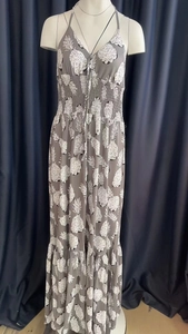 Detail of summer maxi dress with pineapple print, V-neck, and elastic high waist design