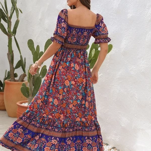 Detail of smocked elastic back and puff sleeves on floral bohemian maxi dress