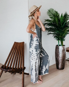 Detailed view of women's gray tie-dye jumpsuit featuring thin straps and wide-leg design