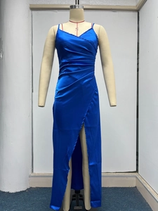 Close-up of the pleated satin bodice and V-neckline of this elegant dark blue maxi dress