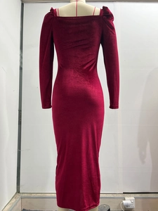 Detailed back view of burgundy velvet midi dress featuring ruched sleeves and bodycon fit