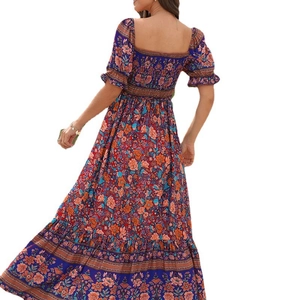 Bohemian floral maxi dress with puff sleeves and smocked back in vintage navy blue
