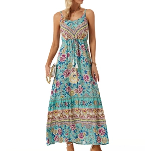 Detailed view of bohemian floral print maxi dress featuring white tassel drawstring waist