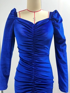 Close-up of royal blue velvet dress showing ruched texture and elegant sweetheart neckline