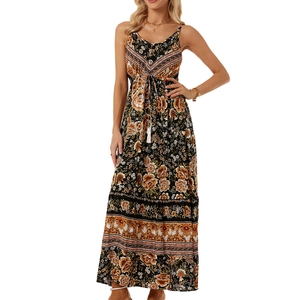 Detail of bohemian floral print maxi dress with V-neck and tassel drawstring waist