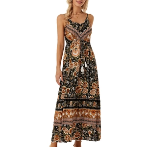 Detail of bohemian floral maxi dress featuring V-neckline and drawstring tassel accents