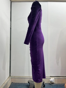 Detail view of purple velvet ruched dress showing rich texture and slim fit design