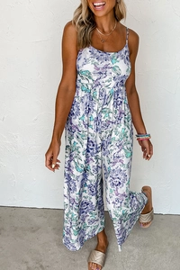 Detail of floral wide-leg jumpsuit with purple print and pleated waistline for women