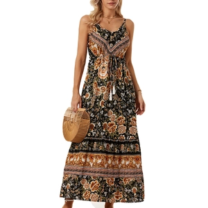 Detail of bohemian floral maxi dress featuring ethnic patterns and tassel drawstring waist