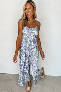 Close-up of lightweight floral jumpsuit with thin straps and wide-leg summer design