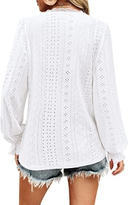 Detail of white long sleeve eyelet embroidery top with lace collar and ruffled cuffs