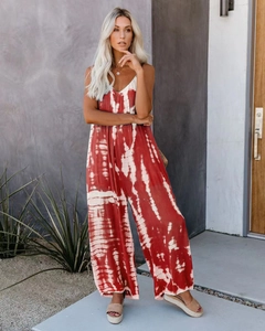 Detail of red and white tie-dye wide leg jumpsuit with v-neck and spaghetti straps