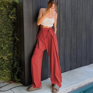 Women's high waist brick red wide leg trousers with a stylish tie-waist detail