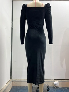 Detail view of the back tailoring and ruching of the black long sleeve slim maxi dress