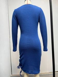 Back view of a royal blue ribbed knit midi dress with side drawstring and ruched detail