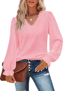 Detail of pink lace embroidery V-neckline and ruffled cuffs on long sleeve blouse