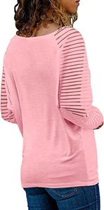 Detail view of pink long sleeve top featuring sheer striped mesh cutouts on the sleeves