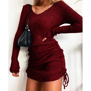 Detail view of the V-neckline and ribbed knit texture on the burgundy slim fit dress