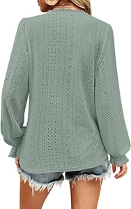 Detail view of the back showing hollow out vertical stripes and ruffled cuffs in sage green