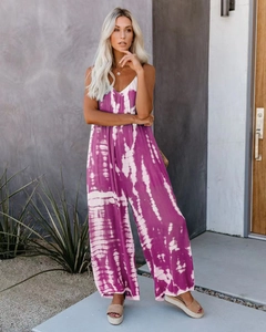 Detail of purple and white tie-dye sleeveless wide-leg jumpsuit on model outdoors