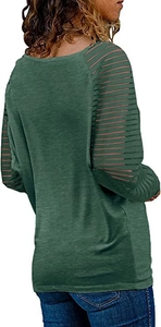 Detail view of dark green women's top featuring unique hollow-out lattice sleeve design
