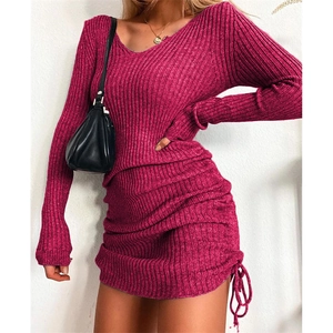 Macro detail of the rose red ribbed knit fabric with side drawstring ruched texture