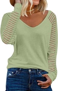 Detail of light green V-neck top showing semi-transparent striped mesh patchwork sleeves