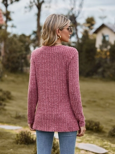 Detail of dusty rose ribbed knit top showing back contour and soft texture