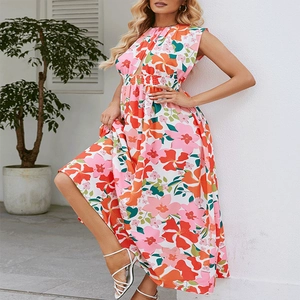 Detail of summer halter maxi dress featuring vibrant floral print and elastic high waist