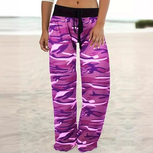 Detail of adjustable black drawstring and waistband on purple camouflage wide leg pants