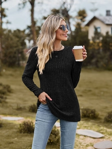 Detail of black ribbed long sleeve t-shirt showing the textured knit and crew neck