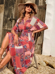 Detail of bohemian V-neck maxi dress featuring geometric prints and elastic high waist