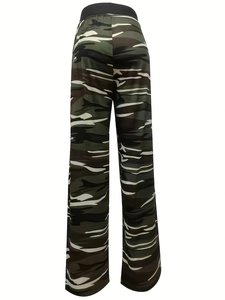 Detail of camouflage trousers featuring elastic waistband and jungle pattern fabric